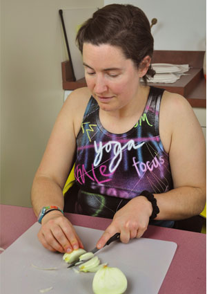 Claudia cutting onion